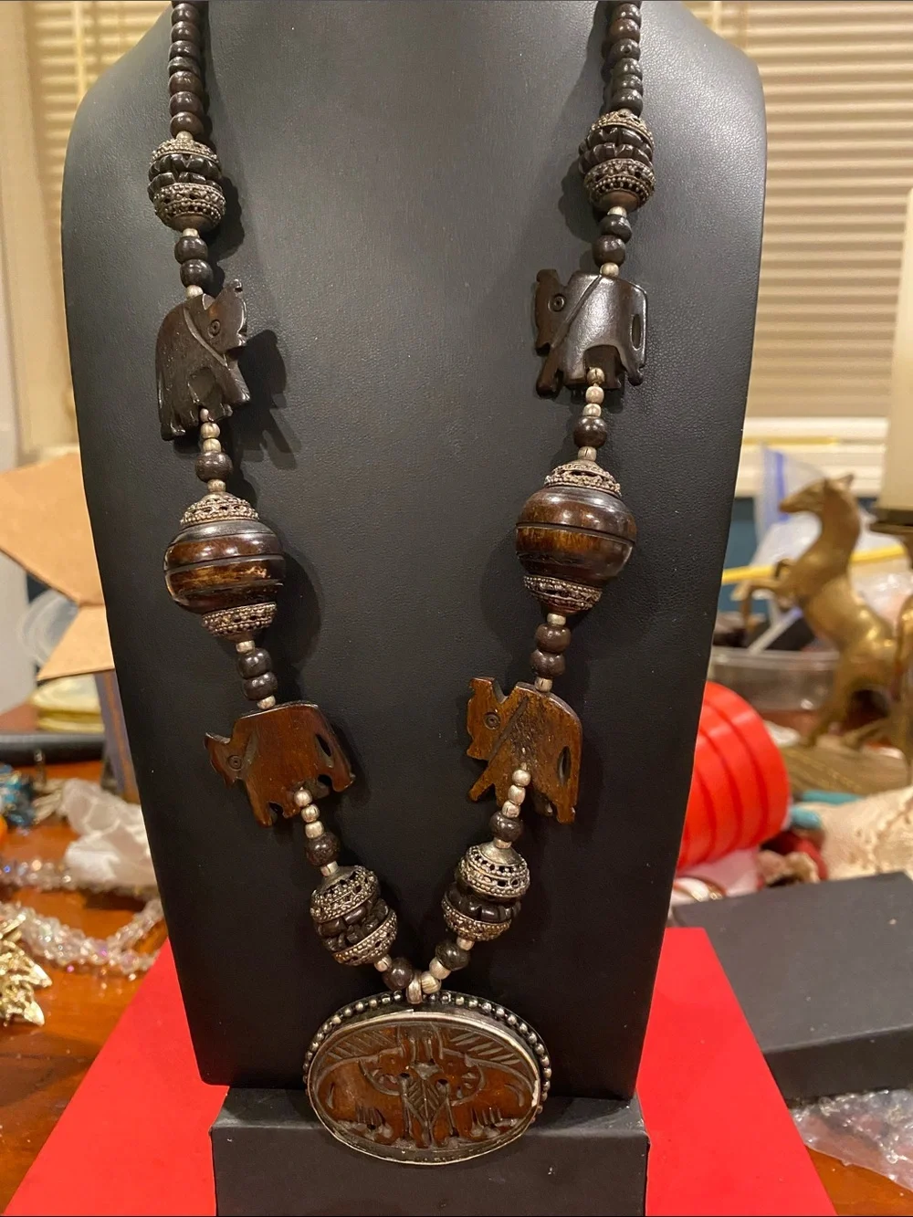 Handcrafted Elephant Pendant Necklace - Brown. Small elephants are bone.